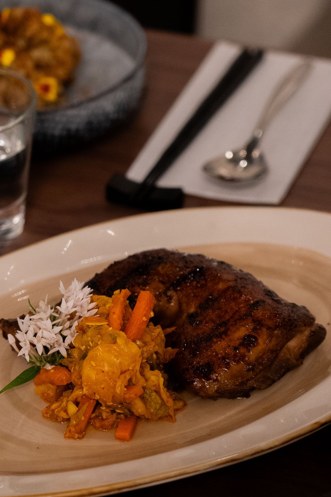 Wood-fired grilled main course plated at Botanico restaurant in The Summerhouse