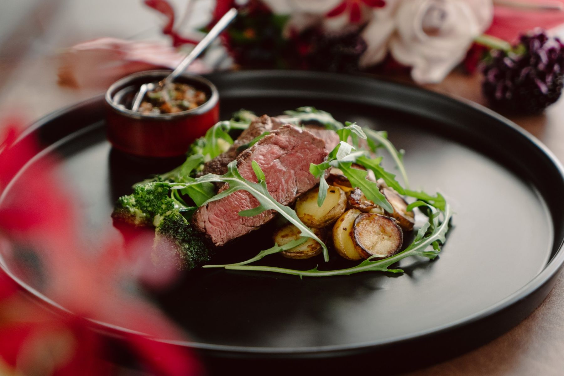 Sliced beef steak with roasted potatoes and rocket from the Botanico wedding menu at The Summerhouse