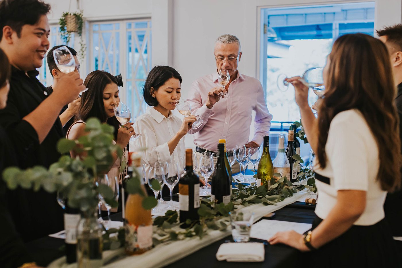 Colleagues raising a toast at a corporate cocktail reception at The Summerhouse