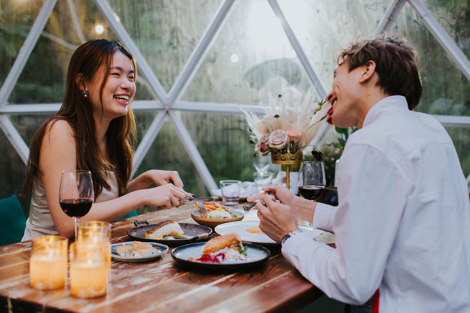 Couple enjoying a private dinner inside a glass Garden Dome at The Summerhouse