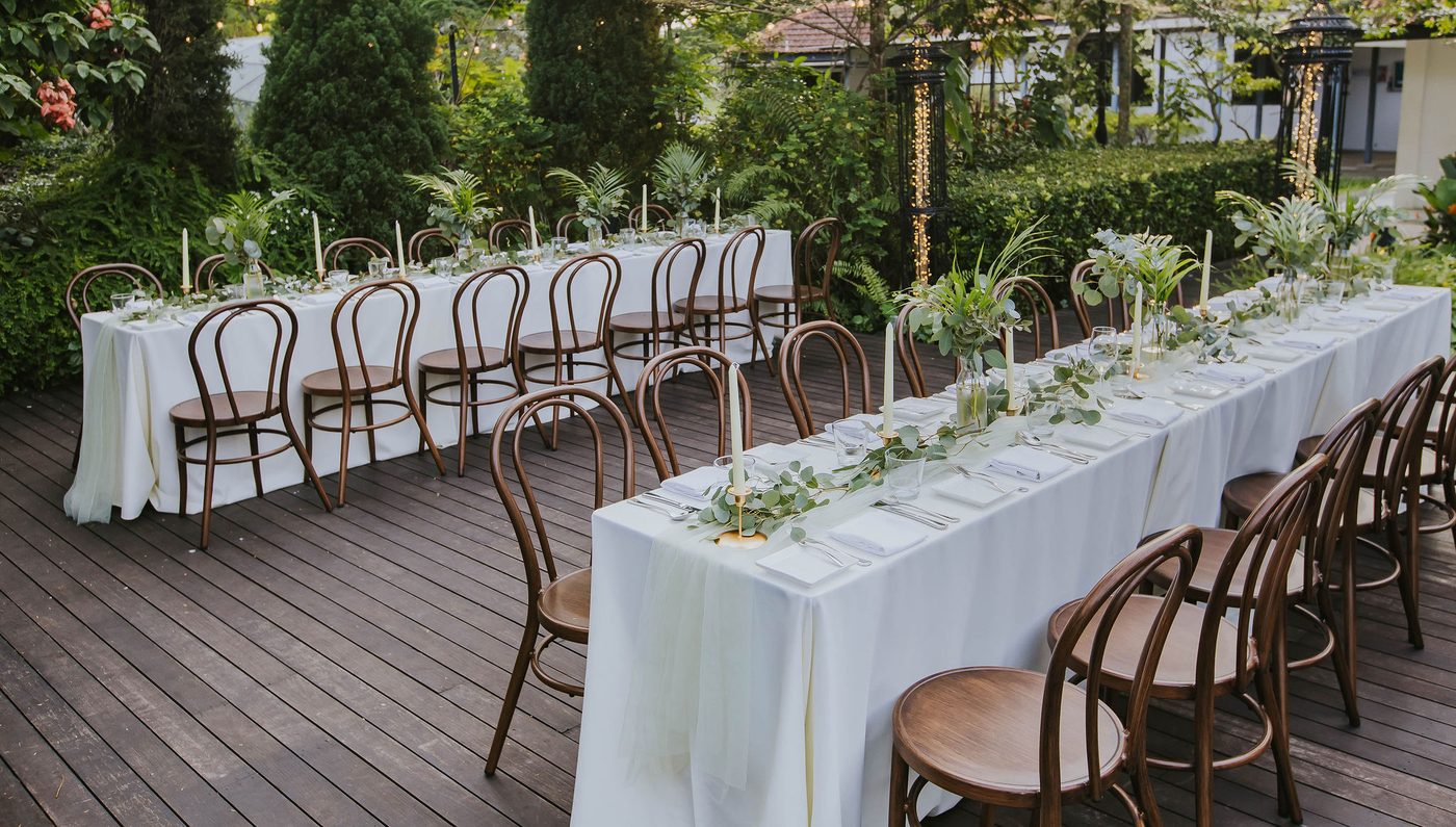 Long table event dinner set on the garden deck at The Summerhouse Seletar
