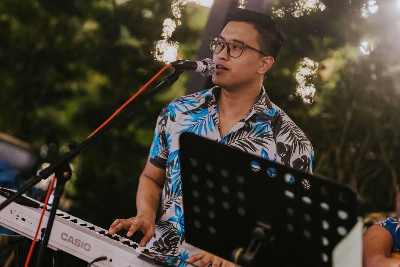 Singer performing live music for guests at Wildseed Bar, The Summerhouse
