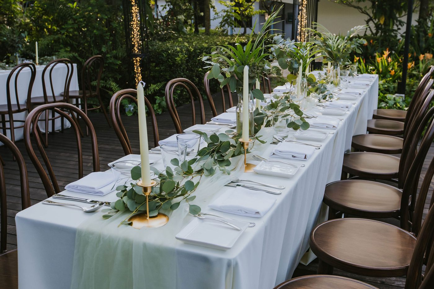 Long table dinner set on the verandah at The Summerhouse Seletar