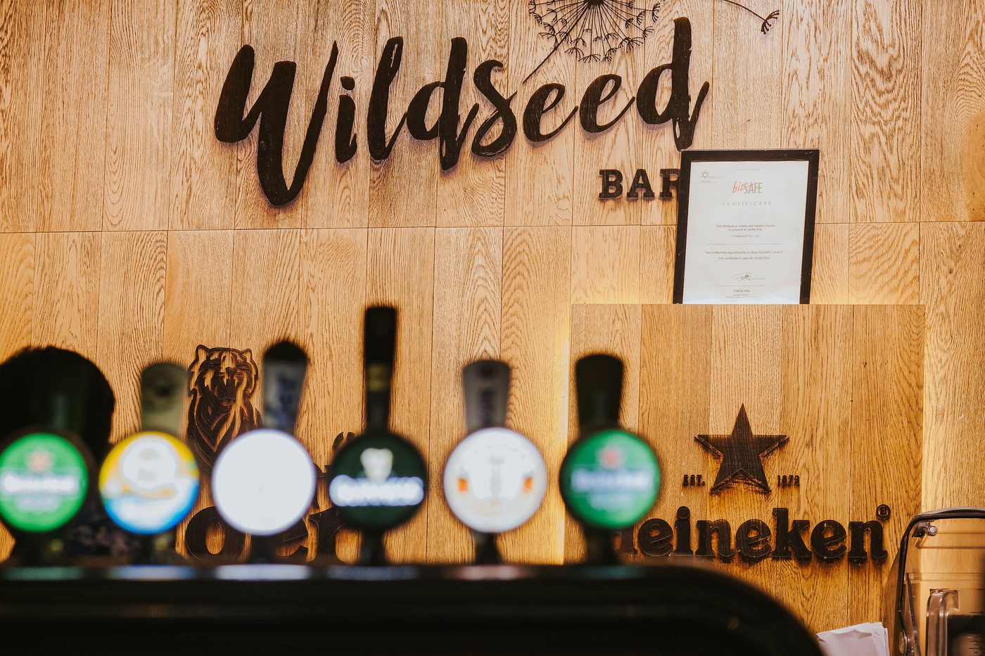 Beer taps and neon sign at Wildseed Bar, The Summerhouse